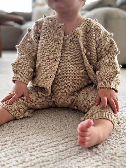 Organic cotton vest with pom poms
